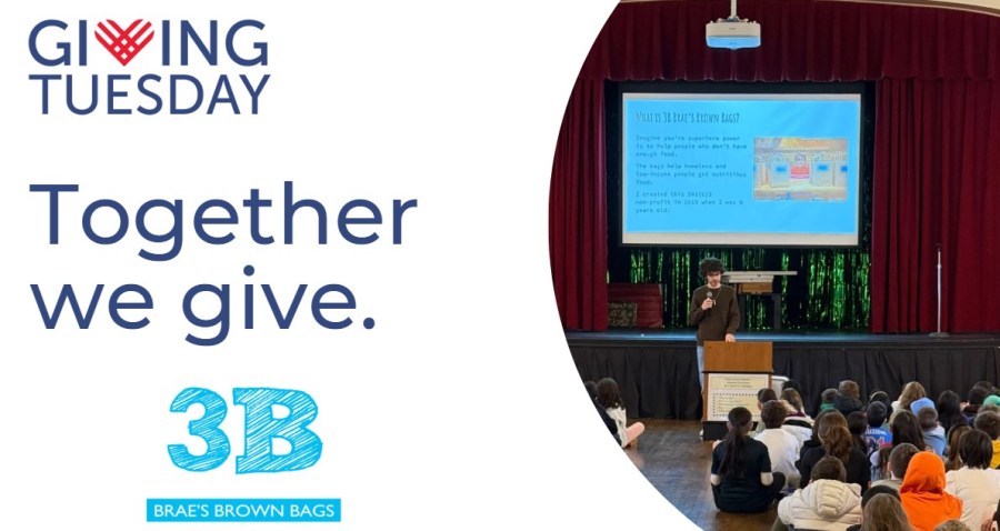 Braeden Mannering speaking to a group of students in an auditorium